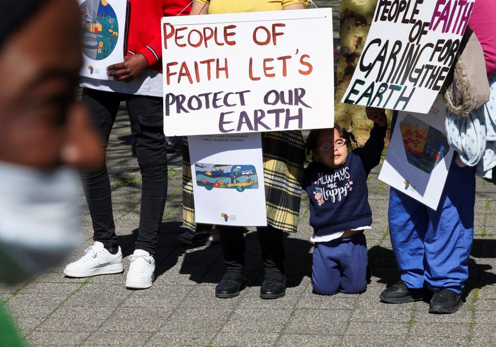 Climate activists demonstrate in South Africa outside the Cape Town International Convention Center Sept. 13, 2023, during the Southern Africa Oil and Gas Conference to call for climate justice resistance against oil and gas corporations and an end to fossil fuels. 