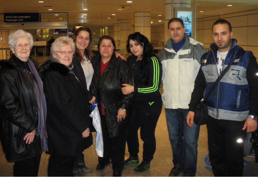 Srs. Gabrielle Servant and Pierette Bertrand welcomed their fourth Syrian family of refugees at the Montreal airport in May 2014. 