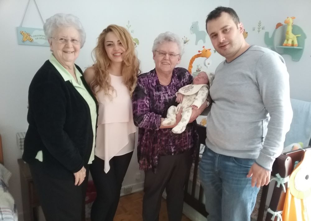 Franciscan Oblates of St.-Joseph Srs. Gabrielle Servant and Pierette Bertrand visit a Syrian family and their newborn in 2017. They started working with refugees in 2012 when Syrian refugees came to Canada after the war in Syria.