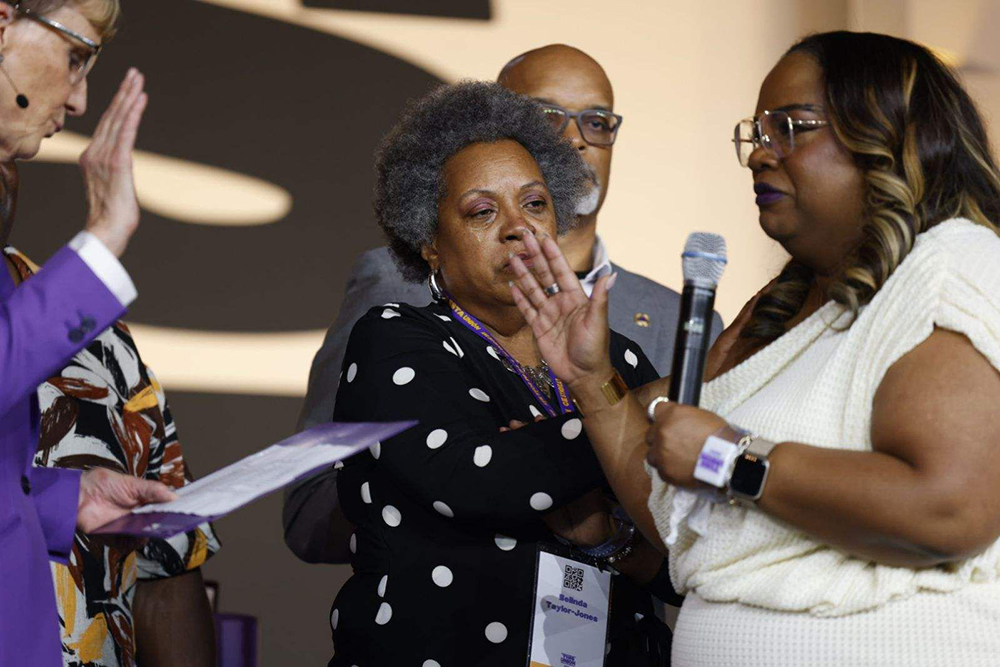 April Verrett, right, receives an SEIU presidential oath from Emeritus Mary Kay Henry in downtown Philadelphia on May 19, 2024. (Verrett/X)