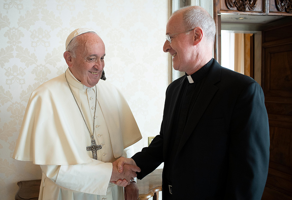 Pope Francis greets Jesuit Fr. James Martin, author and editor at large of America magazine, during a private meeting at the Vatican in this Oct. 1, 2019, file photo. (CNS/Vatican Media)