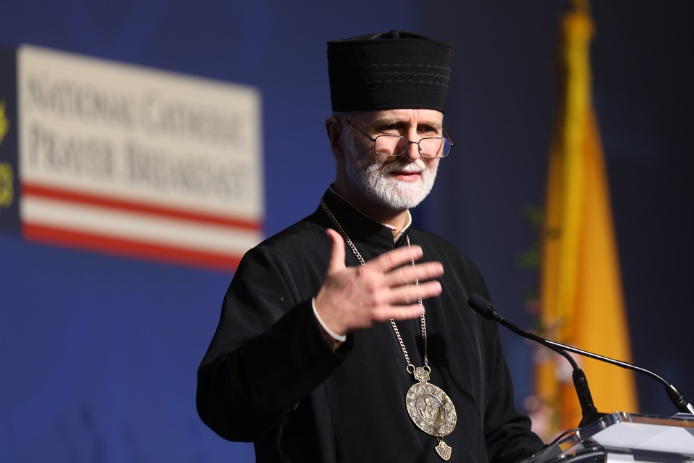 Bishop speaks from lectern