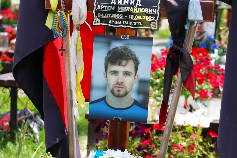 Artem Dymyd, a 27-year-old Ukrainian Catholic University graduate who was killed in battle in June 2022, lies buried at the military cemetery in Lviv, Ukraine. (OSV News Gina Christian)