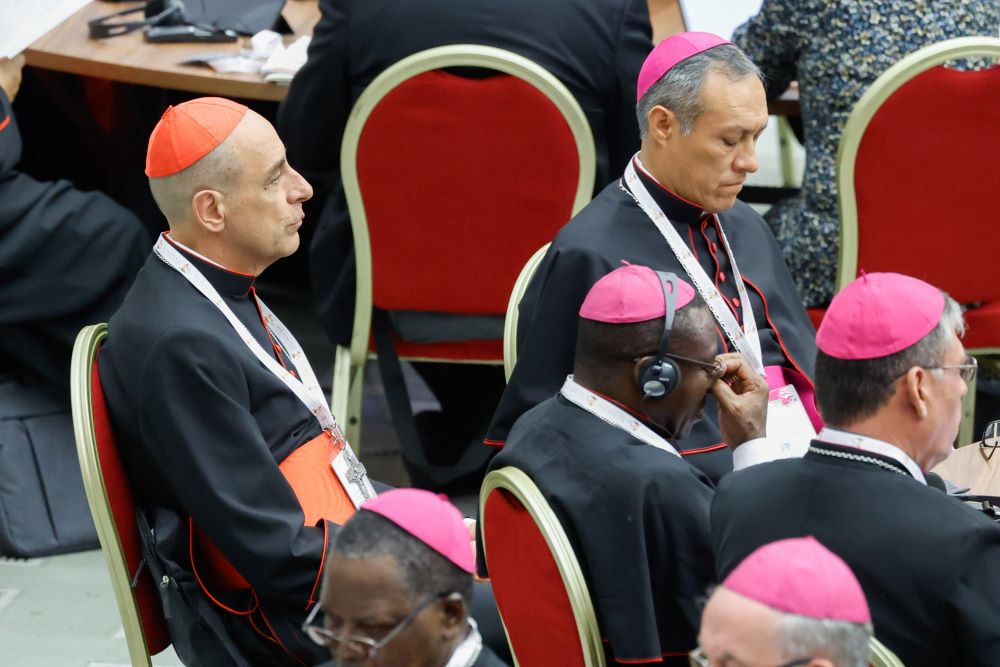 Cardinal Víctor Manuel Fernández, prefect of the Dicastery for the Doctrine of the Faith, participates in the first working session of the assembly of the Synod of Bishops in the Vatican's Paul VI Audience Hall Oct 4.
