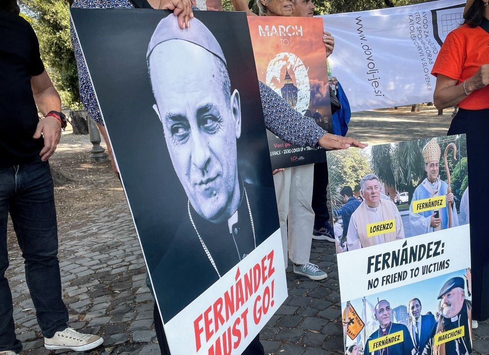 Representatives of international victims' initiatives demonstrate in Rome Sept. 28, 2023, holding protest posters, including one that reads, "Fernández must go!" 