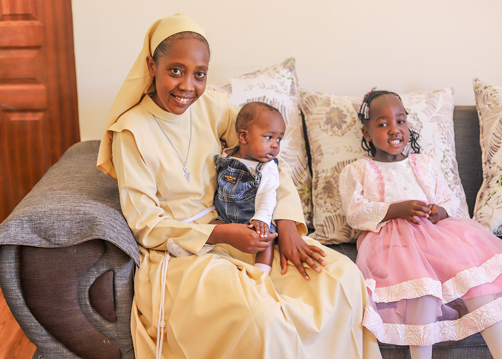 Sr. Ann Wanjiru, a member of the Little Sisters of St. Francis of Assisi, interacts with children on Jan. 18 at St. Josephine Bakhita Babies Home in Busia, a town in western Kenya. (GSR photo/Doreen Ajiambo)