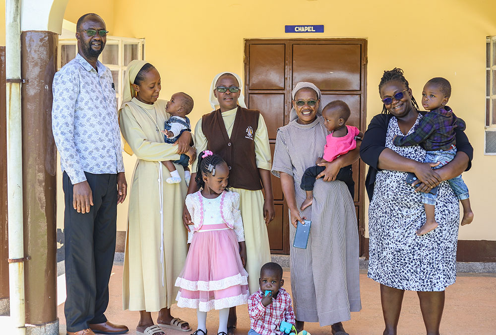 Religious sisters with parents who adopted a child at St. Josephine Bakhita Babies Home in Busia, a town in western Kenya (GSR photo/Doreen Ajiambo)