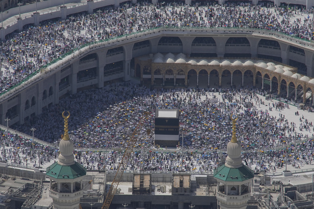 Immense mosque courtyard filled with people