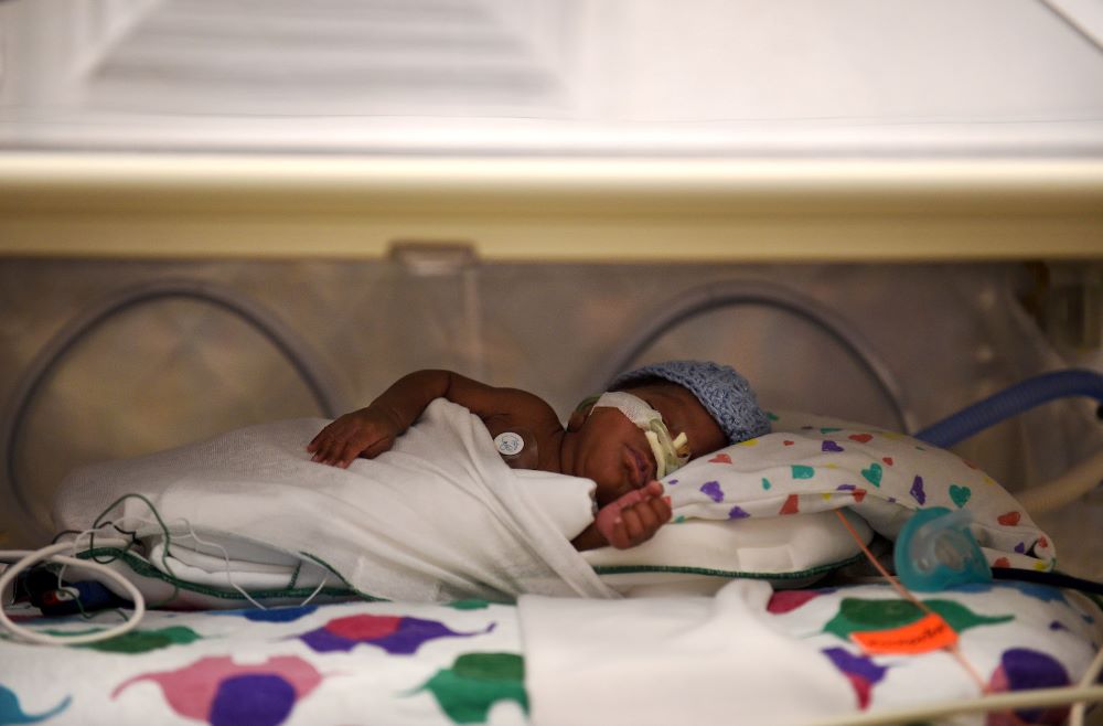 Breast milk is fed via tubes to a preterm infant at a neonatal intensive care unit in Washington, D.C., in 2017. (Grist/The Washington Post via Getty Images/Astrid Riecken))