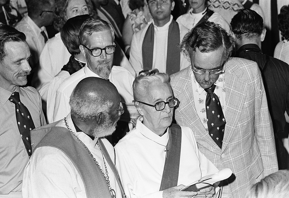 Jeannette Piccard is pictured with (clockwise, left to right) the Rev. Denzil Carty and her three sons Donald, John and Paul, during the processional at the Church of the Advocate, July 29, 1974, in Philadelphia. There she and 10 other women became the first women ordained to the Episcopal priesthood in the U.S. (Brad Hess)