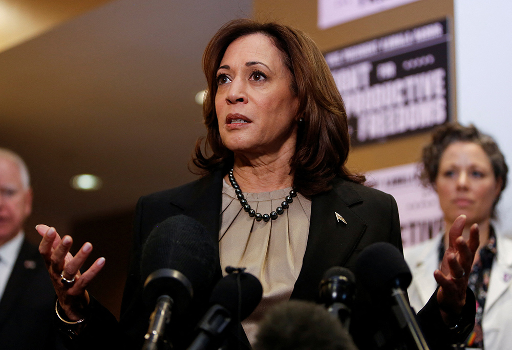 Minnesota Gov. Tim Walz and Dr. Sarah Traxler look on as U.S. Vice President Kamala Harris speaks as she visits an abortion clinic in Minneapolis March 14, 2024. It was the first time a president or vice president visited an abortion clinic. (OSV News/Reuters/Nicole Neri)