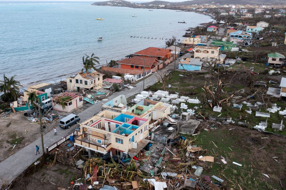 Scattered debris and houses with missing roofs are seen in a drone photograph July 2, 2024, after Hurricane Beryl passed the island of Petite Martinique, Grenada. (OSV News/Reuters/Arthur Daniel) 