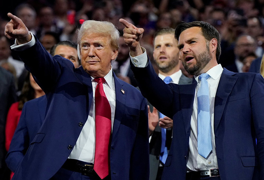 Republican presidential nominee and former U.S. President Donald Trump and Republican vice presidential nominee J.D. Vance point to the stage during Day 1 of the Republican National Convention, July 15 in Milwaukee, Wisconsin. (OSV News/Reuters/Elizabeth Frantz)