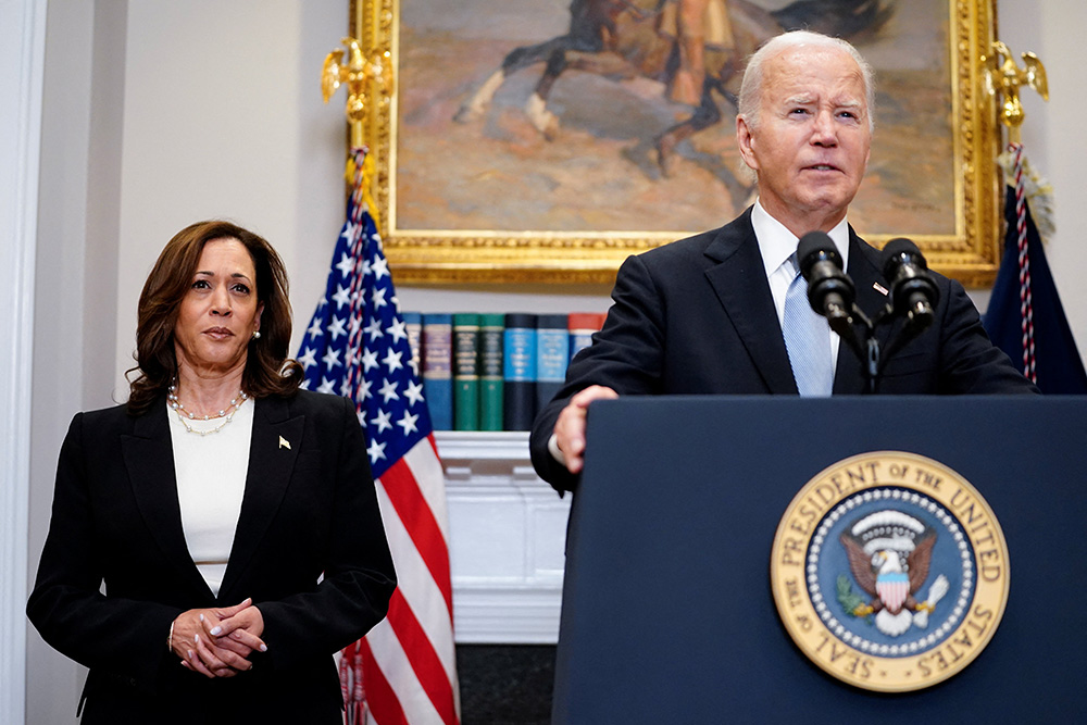 President Joe Biden speaks next to Vice President Kamala Harris as he delivers a statement a day after Republican challenger Donald Trump was shot at a campaign rally, during brief remarks at the White House in Washington, July 14. In an announcement July 21, Biden said he made the historic decision to end his 2024 election bid. (OSV News/Reuters/Nathan Howard)