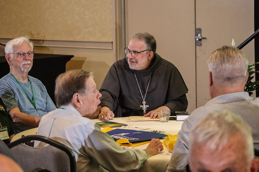 Bishop John Stowe of Lexington, Kentucky, is seen with attendees at the assembly of the Association of U.S. Catholic Priests, held June 24-27 in Lexington, Kentucky. (Paul Leingang)