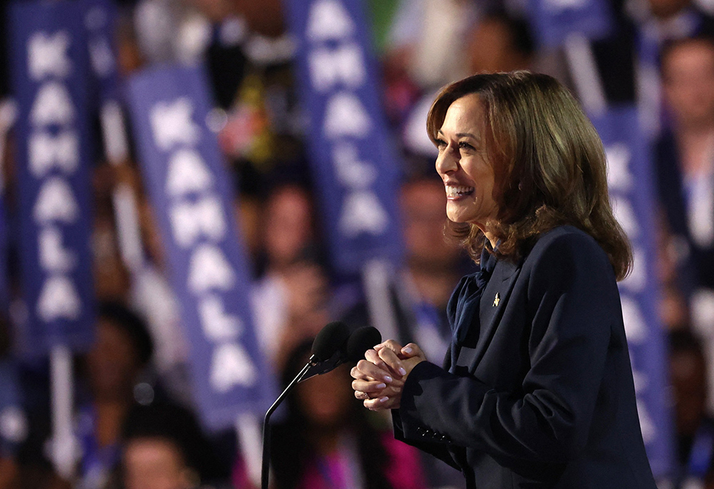 Democratic presidential nominee and U.S. Vice President Kamala Harris takes the stage during the Democratic National Convention at the United Center in Chicago on Aug. 22. (OSV News/Reuters/Brendan Mcdermid)