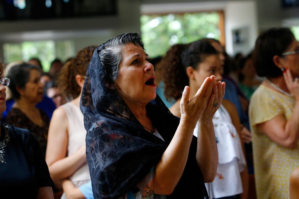 A woman prays during Mass at Divine Mercy Catholic Church in Managua, Nicaragua. 