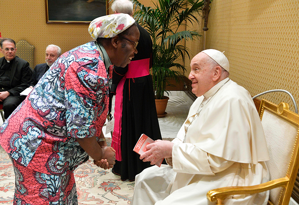 Pope Francis greets Congolese Sr. Josée Ngalula, a Sister of St. Andrew and one of five women theologians on the International Theological Commission, a body that studies theological questions for the Dicastery for the Doctrine of the Faith, Nov. 30, 2023, at the Vatican. (CNS/Vatican Media)