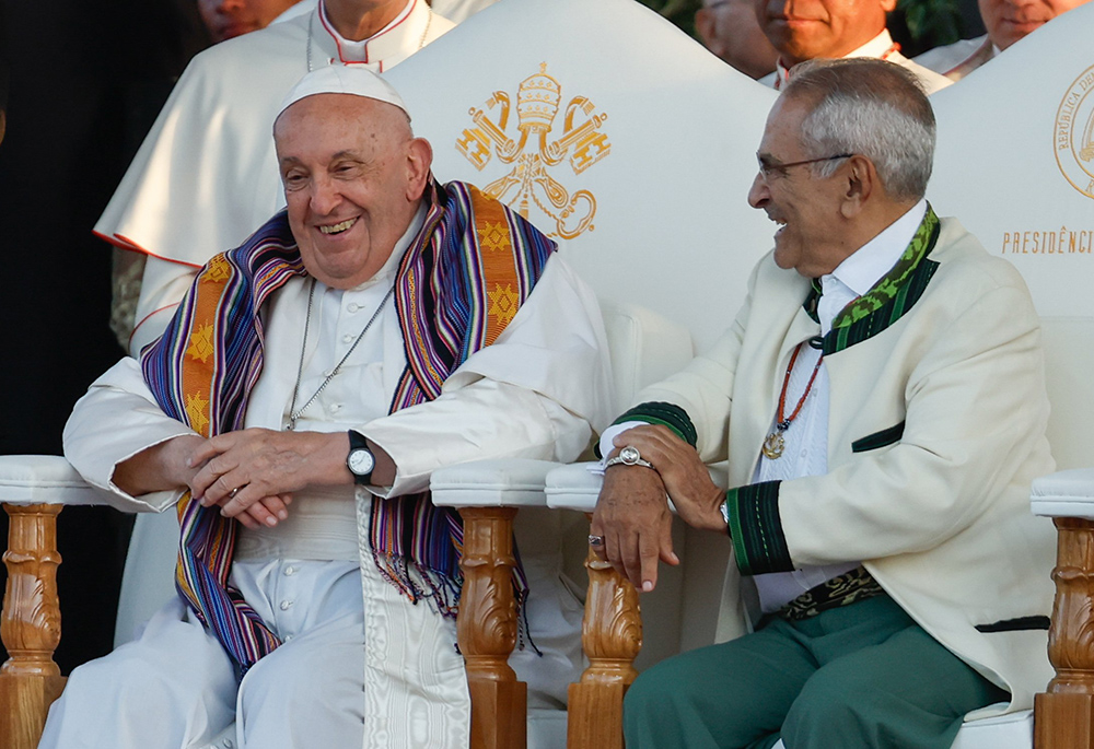 Pope Francis and President of Timor-Leste José Ramos-Horta share a laugh during a welcome ceremony at the presidential palace, Sept. 9 in Dili, Timor-Leste. (CNS/Lola Gomez)