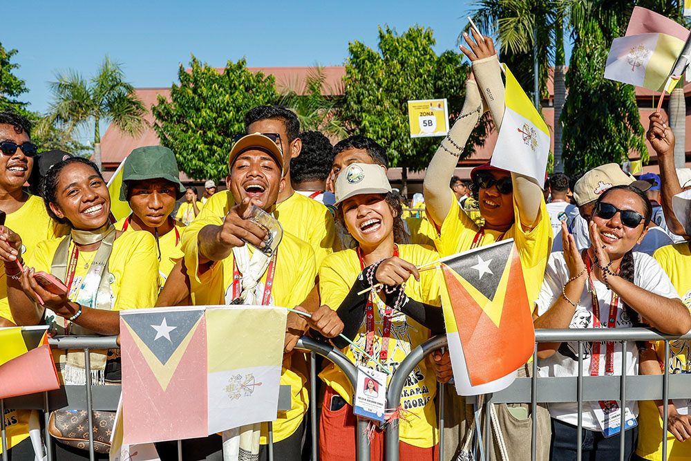 Young people wait for Pope Francis outside a convention center in Dili, Timor-Leste, Sept. 11. (CNS/Lola Gomez)