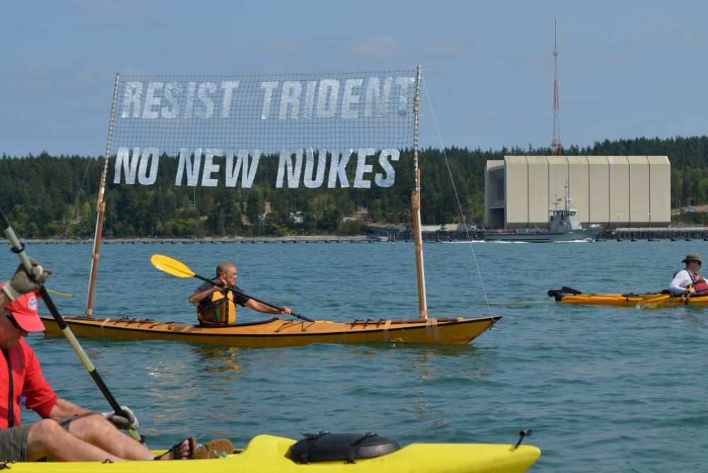 Rodney Brunell participates aboard his kayak in a "peace flotilla" to protest nuclear weapons near Naval Base Kitsap-Bangor in 2016. 