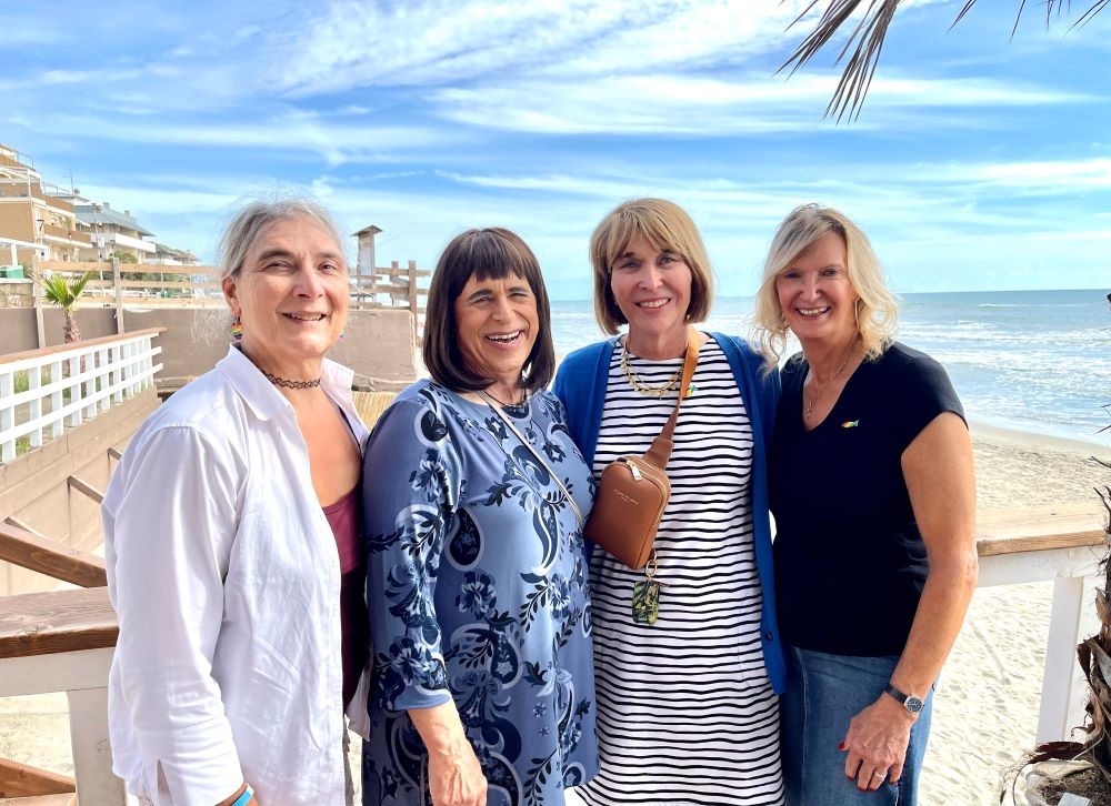 Lynn Discenza, Martha Marvel, Maureen Rasmussen and Christine Zuba pose during a break in Torvaianica, a town outside Rome, during their visit to Fr. Andrea Conocchia's parish on Sept. 16. (Camillo Barone)