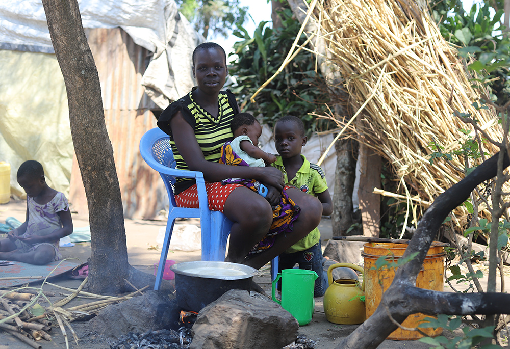 Pauline Ojanji sits with her children at Khumwanda displacement camp, after her house was flooded in Busia, Kenya. (GSR photo/Doreen Ajiambo)