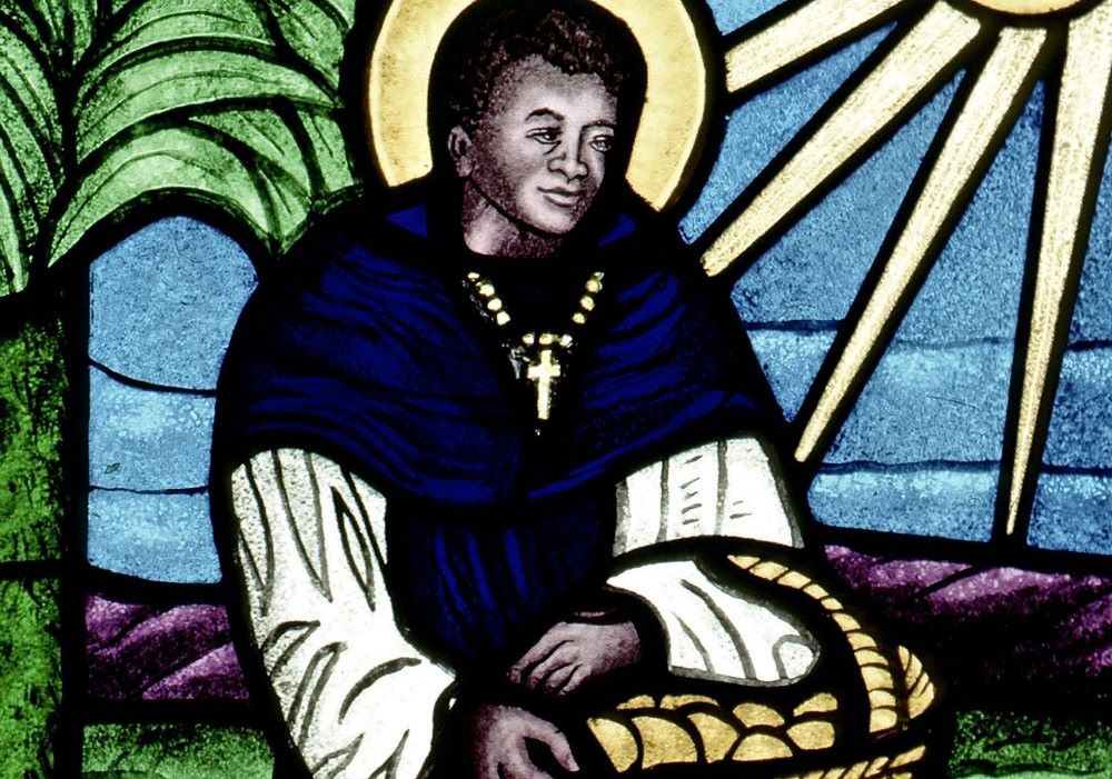 St. Martin de Porres is depicted in a stained glass window.