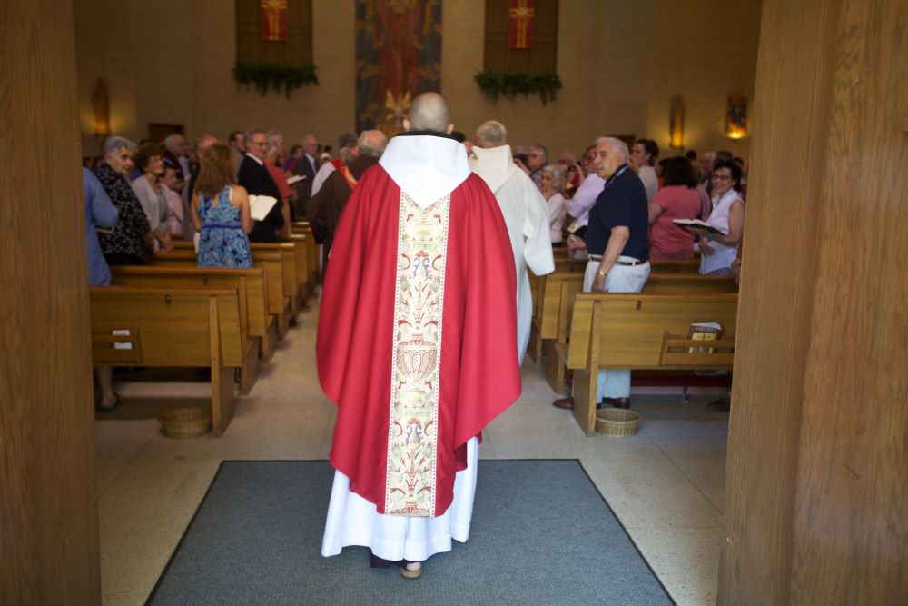 Franciscan Fr. Daniel P. Horan in line to process into Mass in May 2012. 