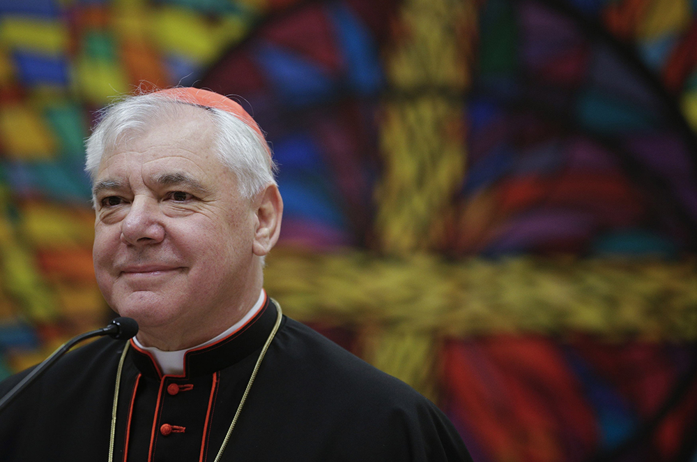 German Cardinal Gerhard Müller, doctrinal congregation prefect, smiles as he holds a news conference to unveil his book "Poor for the Poor: The Mission of the Church" in Rome Feb. 25, 2014. The book includes a preface written by Pope Francis and two chapters contributed by Dominican Fr. Gustavo Gutiérrez, whose works once underwent a lengthy critical review by the doctrinal congregation. (CNS/Reuters/Max Rossi)