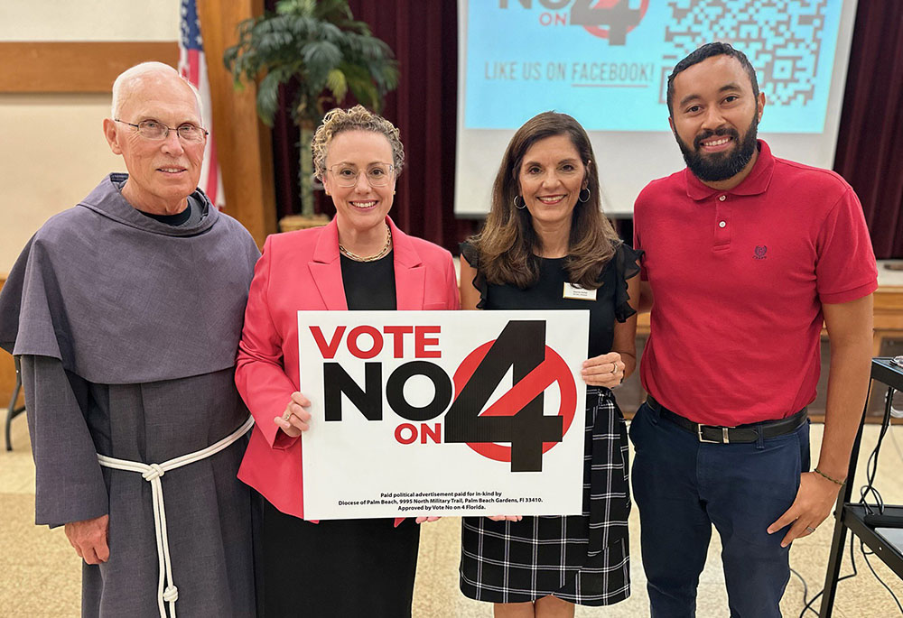 Franciscan Fr. Mark Szanyi, pastor at St. Lucie Parish in Port St. Lucie, Fla., left, stands with Republican state Sen. Erin Grall; Deanna Herbst-Hoosac, who is Catholic Charities Respect Life administrator in the Palm Beach Diocese; and Nelson Sanchez, parish Respect Life member, at an Amendment 4 awareness event July 16, 2024, in Port St. Lucie. (OSV News)