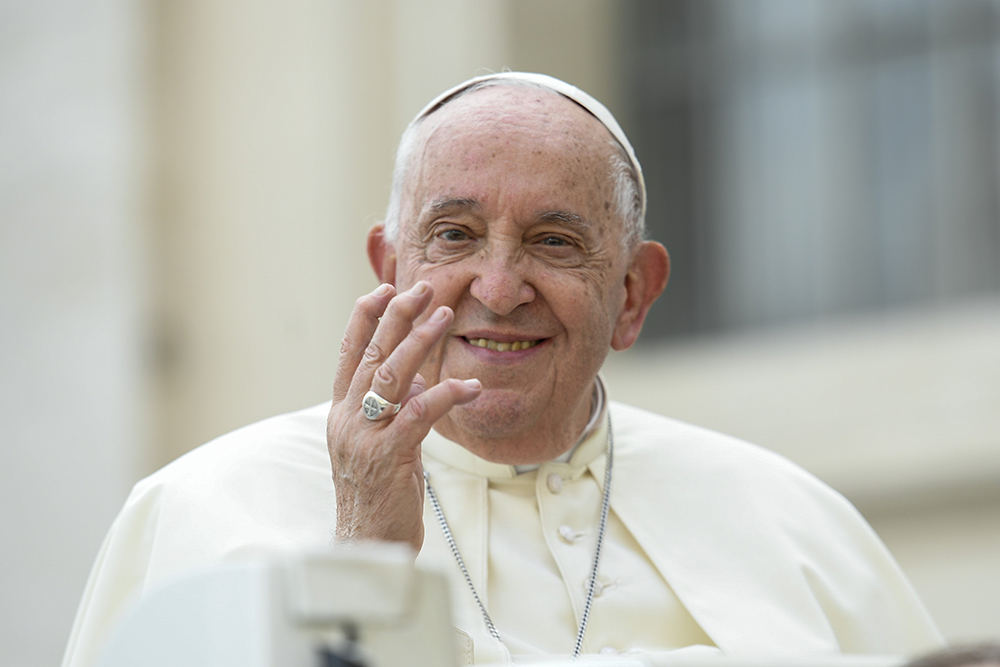 Pope Francis waves to visitors from the popemobile before his weekly general audience in St. Peter's Square at the Vatican Oct. 9, 2024. (CNS/Vatican Media)