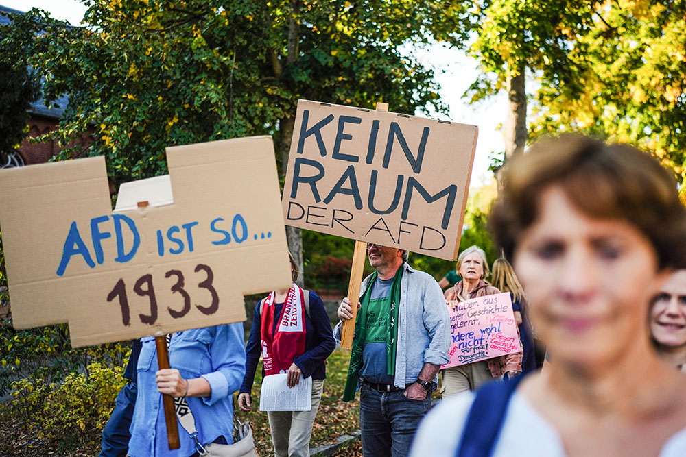 In Potsdam, Germany, Sept. 22, protesters hold placards reading "AFD is so 1933" and " No space for AFD" during a demonstration near the location of Alternative for Germany's election party in the German state of Brandenburg. (AP/Markus Schreiber)