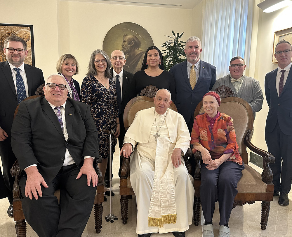 Pope seated surrounded by small group. Gramick and DeBernardo sit on his right and left.