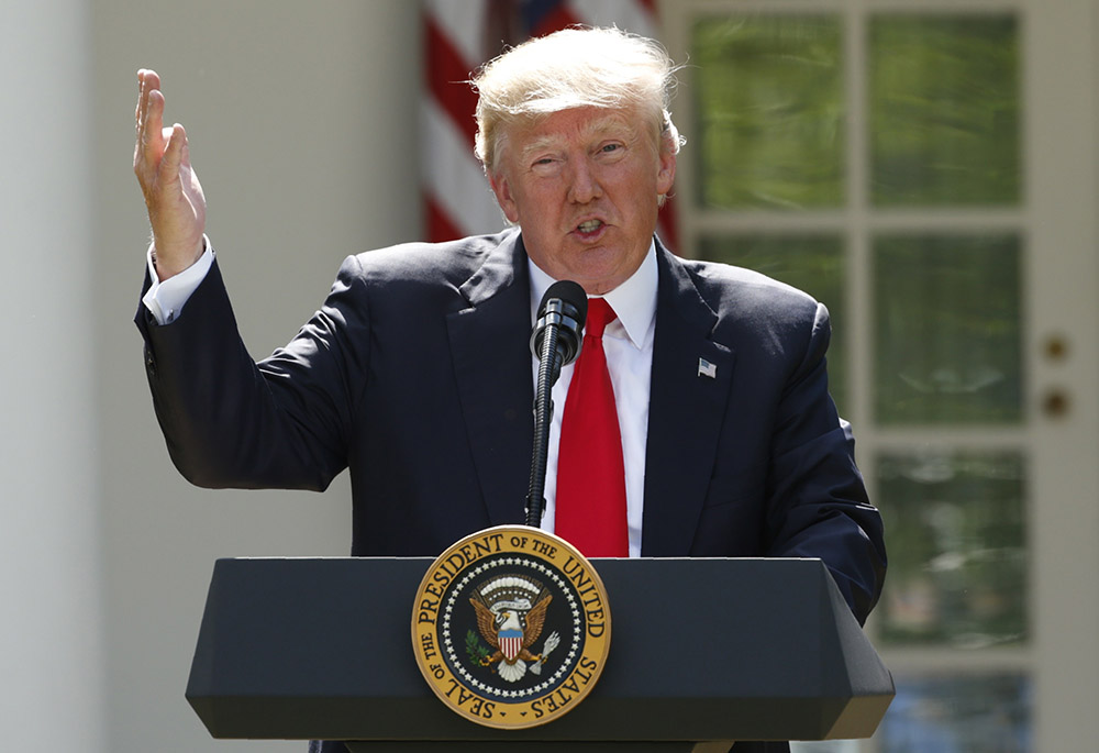 Then-U.S. President Donald Trump announces his decision that the United States will withdraw from the landmark Paris climate agreement June 1, 2017, in the Rose Garden of the White House in Washington. (CNS/Reuters/Kevin Lamarque)