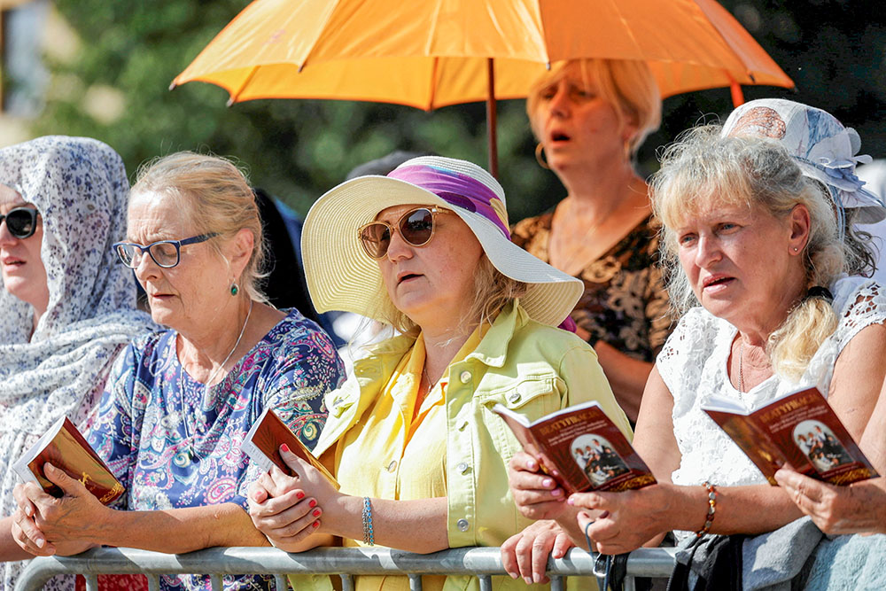 Women pray during the Sept. 10, 2023, Mass in Markowa, Poland, for the beatification of the Ulma family, who were martyred in Markowa for sheltering Jews under German occupation during World War II. (OSV News/Agencja Wyborcza.pl via Reuters/Patryk Ogorzalek)