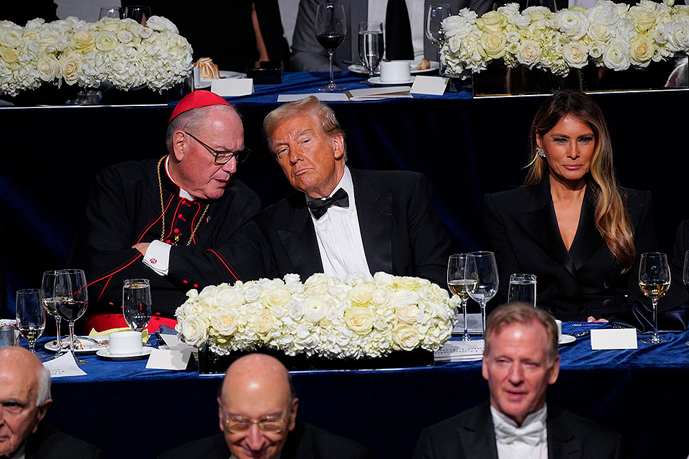 New York Cardinal Timothy Dolan chats with former President Donald Trump during the Alfred E. Smith Memorial Foundation Dinner in New York City Oct. 17. Also pictured is Trump's wife, Melania. (OSV News/Gregory A. Shemitz)