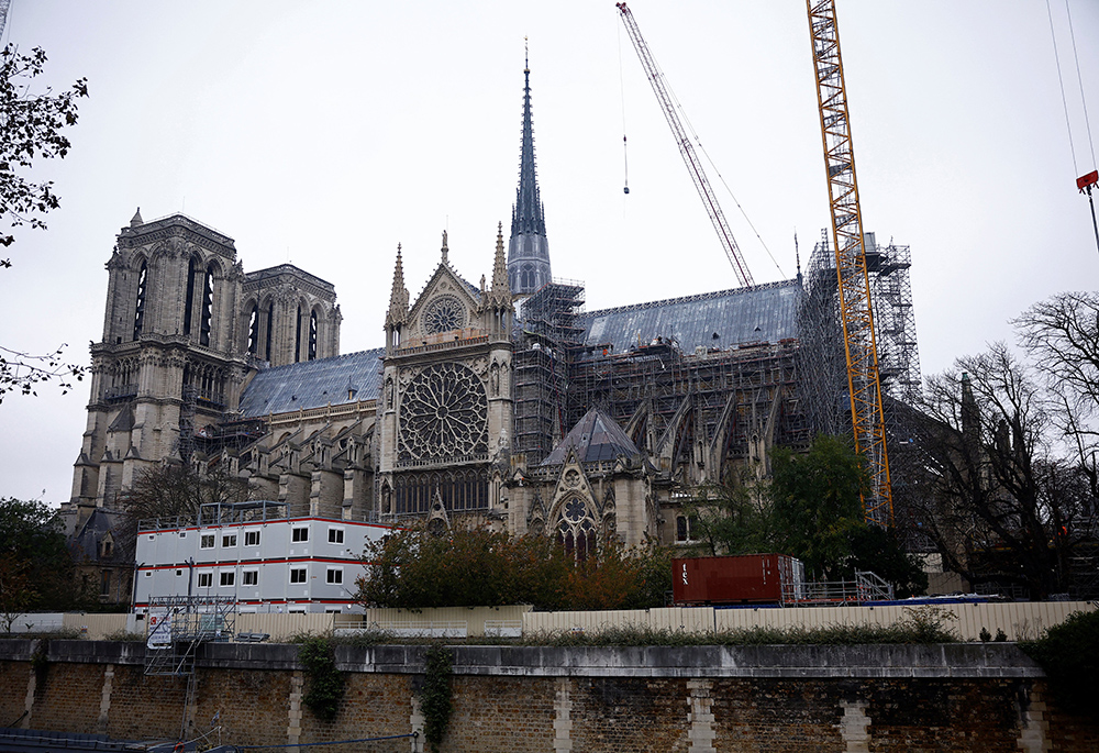 Cranes are seen around the Notre Dame Cathedral in Paris Nov. 7, which was ravaged by a fire in 2019, as restoration work continued before its reopening. The iconic cathedral is scheduled to reopen Dec. 8, to be followed by six months of celebrations, Masses, pilgrimages, prayers and exhibitions. (OSV News/Reuters/Sarah Meyssonnier)