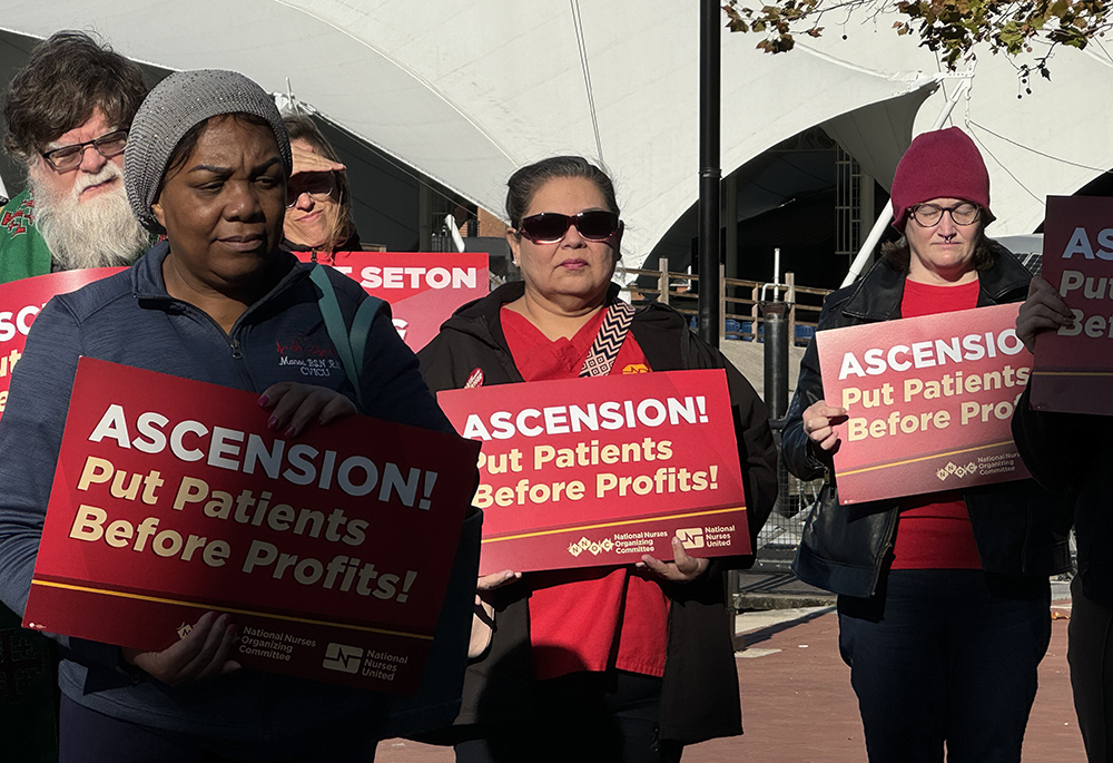 Nurses rally outside the fall meeting of the U.S. Conference of Catholic Bishops Nov. 12 in Baltimore, asking bishops to urge the Catholic hospital chain Ascension for better staffing and patient care. (NCR photo/Rhina Guidos)