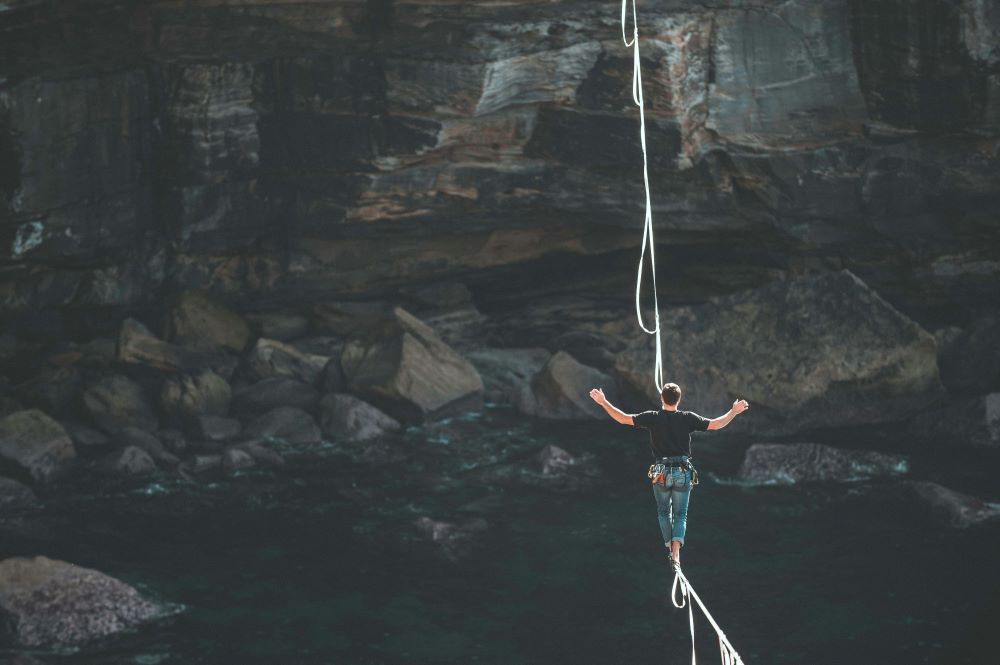 person walks a tightrope