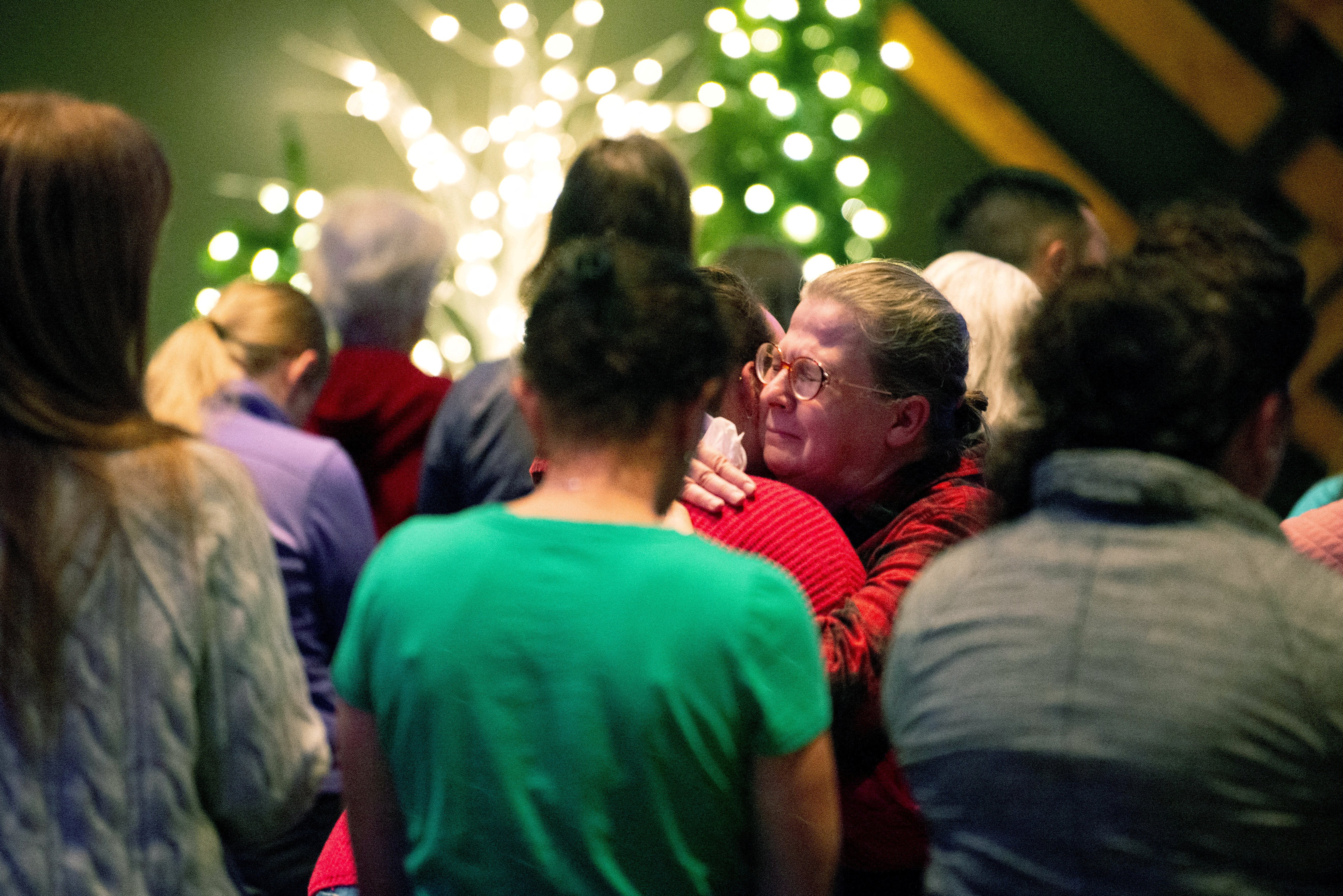 People embrace as worshippers gather at Blackhawk Church in Madison, Wis., Dec. 16, 2024, to pray for victims and survivors of a mass shooting that day at Abundant Life Christian School in Madison. At least three people are dead, including the suspect, and others are injured, after the mass shooting, police said. (OSV News photo/Cullen Granzen, Reuters)