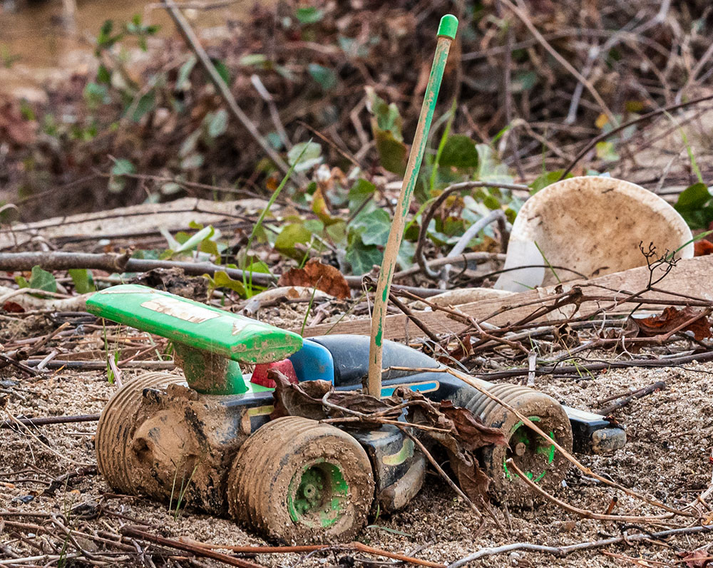 Child's toy race car, on banks of Swannanoa River, Biltmore Village, Dec. 11, 2024 (Darlene O'Dell)