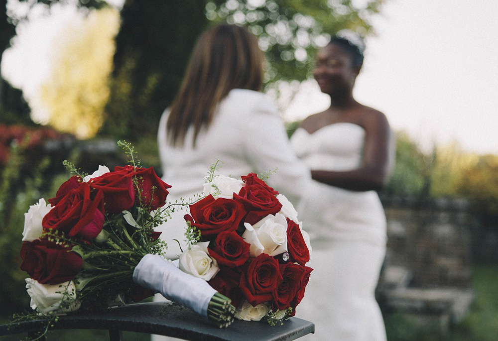 Photo illustration shows two women getting married in an outdoor setting (Pixabay/briannad26)