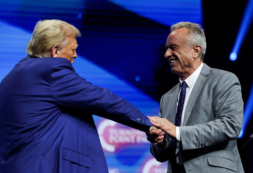 Robert F. Kennedy Jr. and then-Republican presidential candidate and former U.S. President Donald Trump greet each other at a campaign event in Duluth, Georgia, on Oct. 23, 2024. Trump, as president-elect, announced Nov. 14 that Kennedy is his pick for secretary of Health and Human Services. (OSV News/Reuters/Carlos Barria)