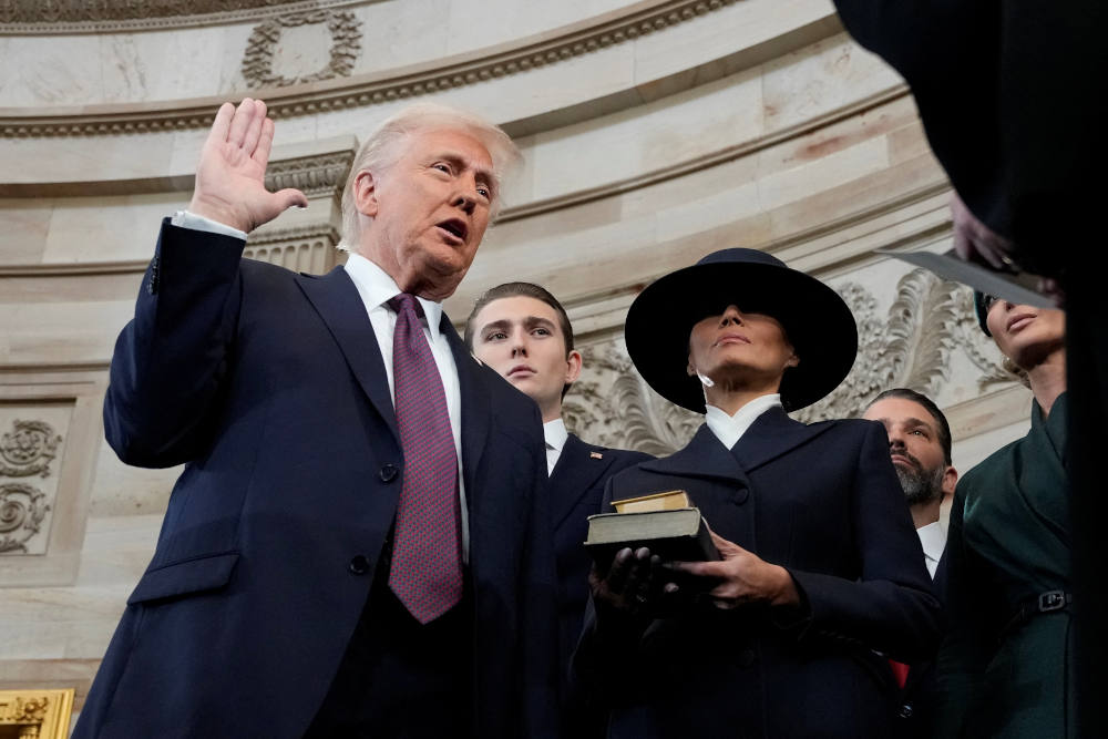 Donald Trump is sworn in as the 47th president of the United States by Chief Justice John G. Roberts as Melania Trump holds the Bible during the inauguration ceremony in the Capitol Rotunda in Washington Jan. 20, 2025. (OSV News photo/Morry Gash, pool via Reuters)