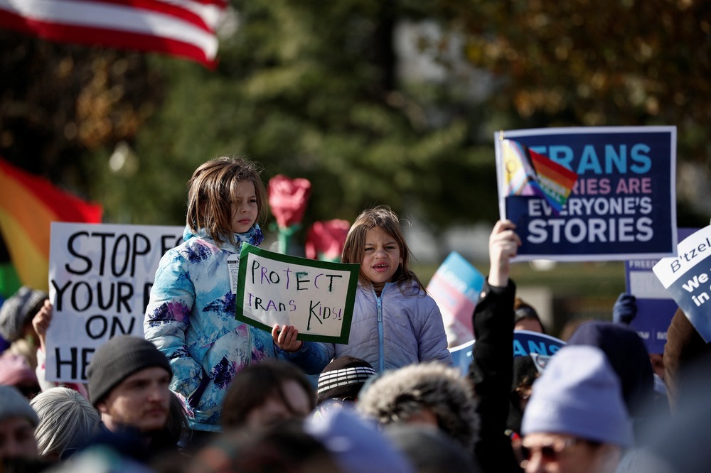 People holding signs. 