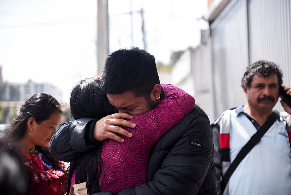 A migrant is greeted by a family member outside the Returned Migrant Reception Center in Guatemala City, Guatemala, Jan. 27, 2025, after he and other Guatemalan migrants arrived at La Aurora Air Force Base on a deportation flight from the U.S. (OSV News/Reuters/Cristina Chiquin)