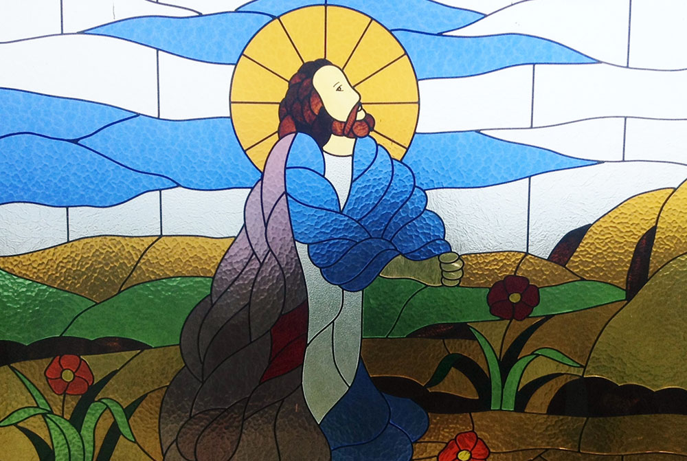 Jesus is depicted praying in a stained glass window in Bukit Doa Getsemane, Ambarita, Samosir, Indonesia (Wikimedia/Christian Advs Sltg)