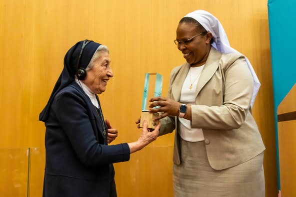 At the Sisters Anti-Trafficking Awards held in Rome on May 23, 2024, Sr. Marie Claude Naddaf, from the Lebanon-Syria Province, receives the Human Dignity Award for her lifetime achievement in addressing exploitation and protecting women and children in the Middle East from human trafficking. The award was presented by Sr. Jane Wakahiu, from the Catholic Sisters initiative at Conrad N. Hilton Foundation. (Courtesy of the Good Shepherd Sisters)