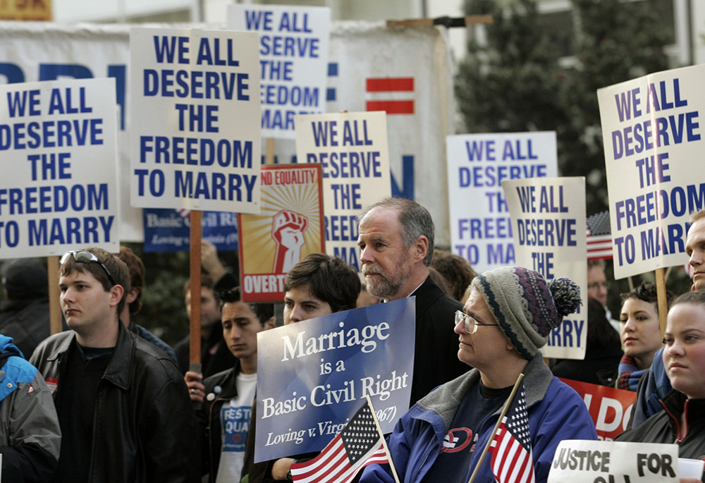 Supporters of gay marriage rally outside the federal courthouse on Jan. 11, 2010, in San Francisco. Majorities of U.S. Catholics support progressive policies on "culture war" issues, such as abortion and gay marriage, according to a new Pew survey of the country's religious landscape. (CNS/Reuters/Robert Galbraith)